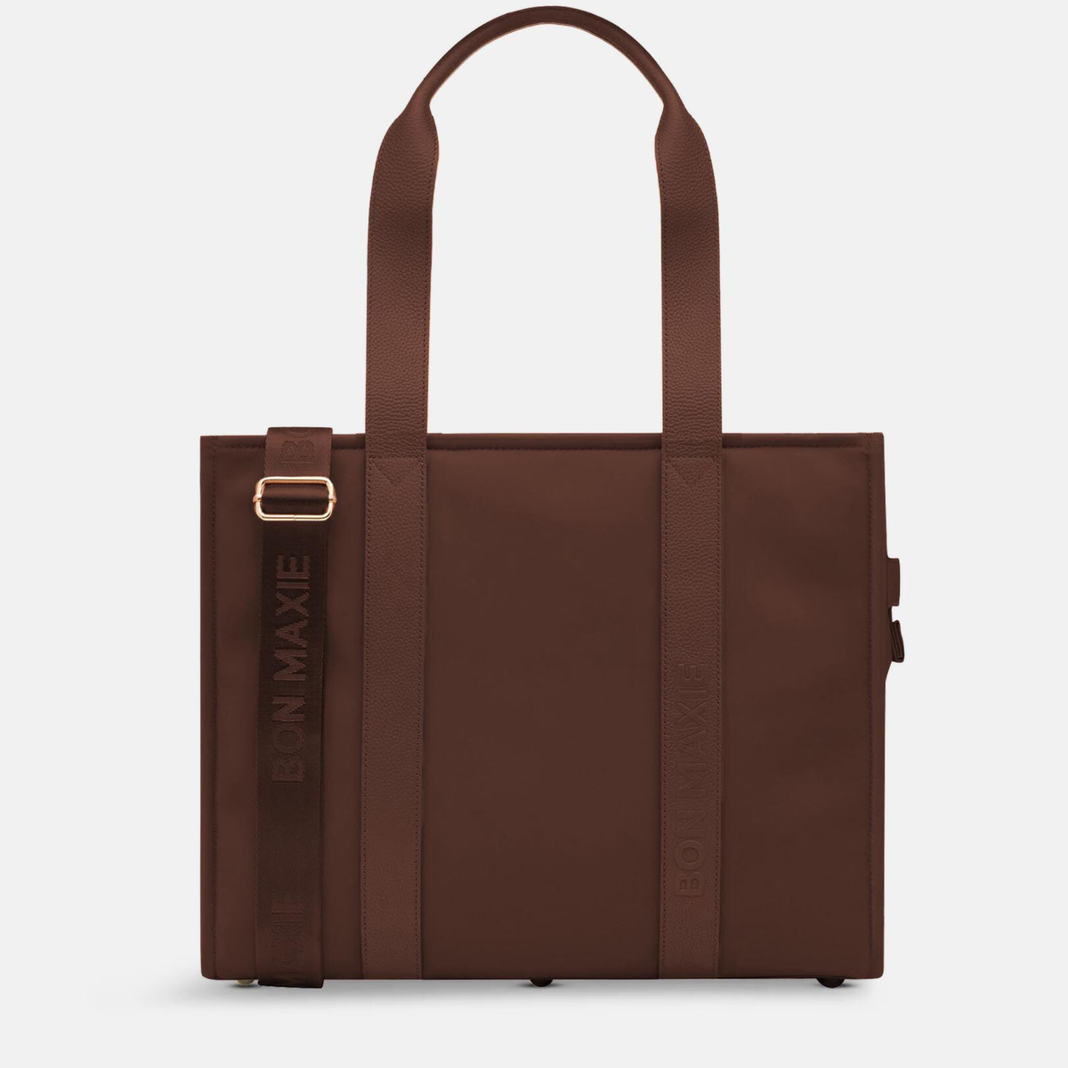 Load video: Woman demonstrating large nylon leather tote in chocolate