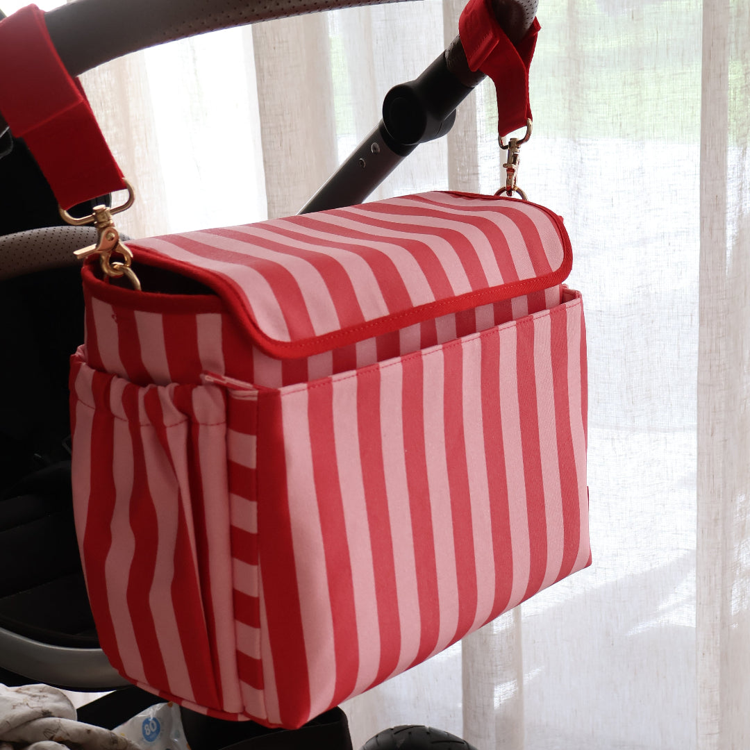 Pram Caddy Bag with pram + crossbody straps in coated canvas - Pink/Red Stripe