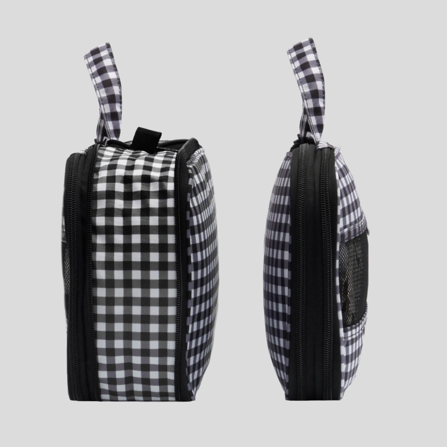 Black and white checkered bag with zippers on a white background