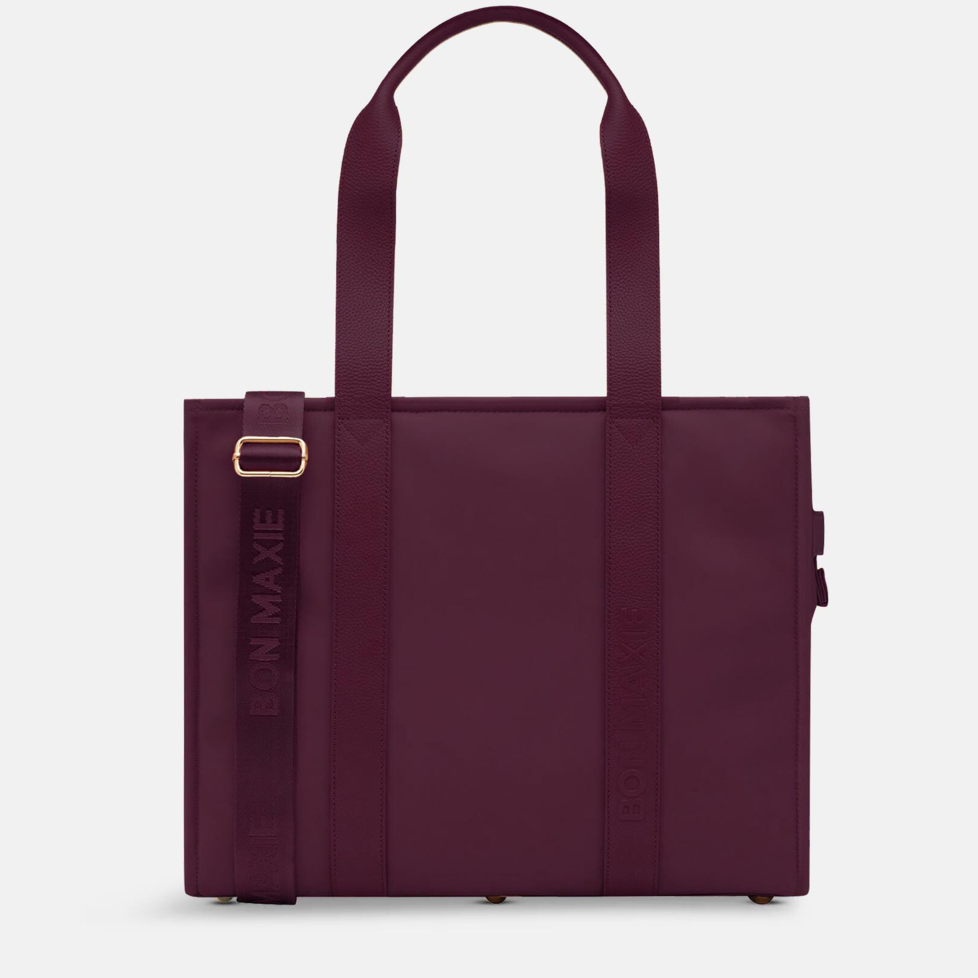 burgundy tote bag with gold buckle on a white background
