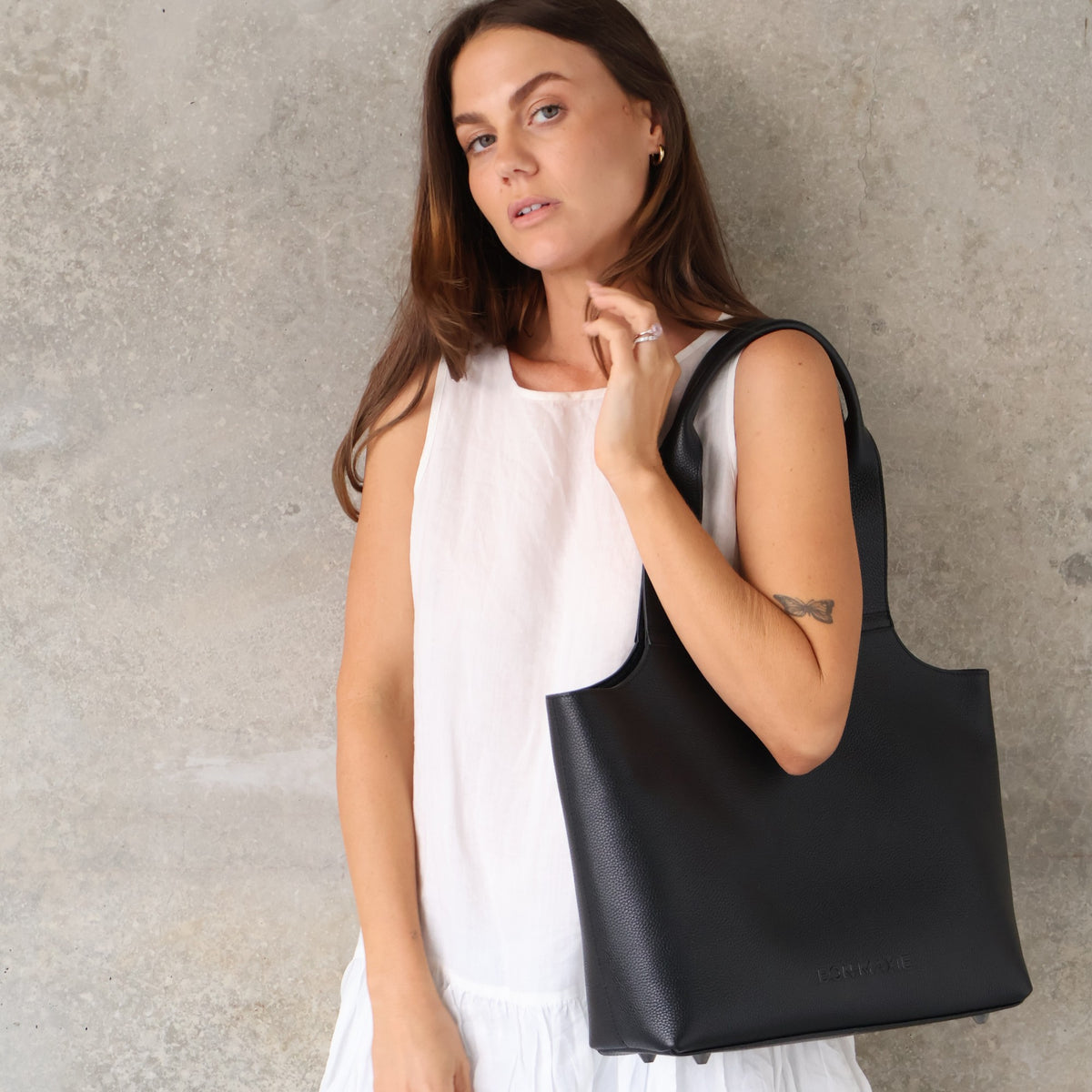 Maven Tote in Black Pebble Leather, styled on model