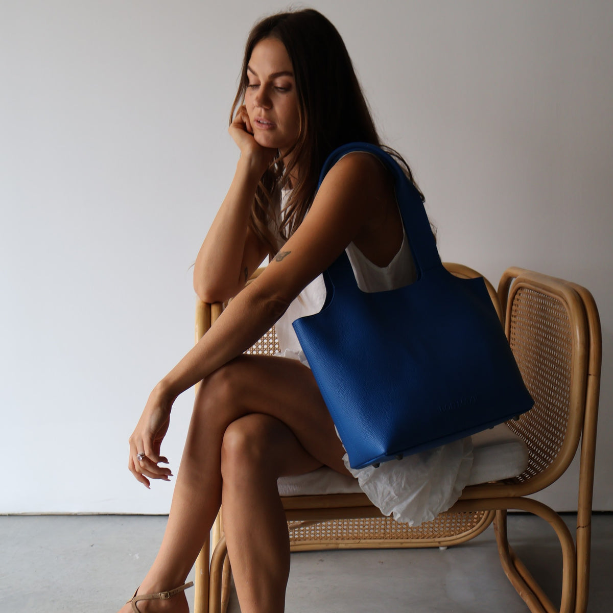 Maven Tote in Cobalt Blue Pebble Leather, styled on model