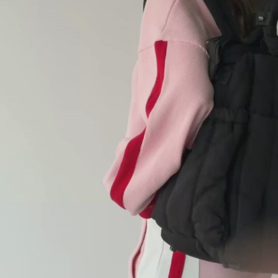 Load video: Woman demonstrating backpack in black