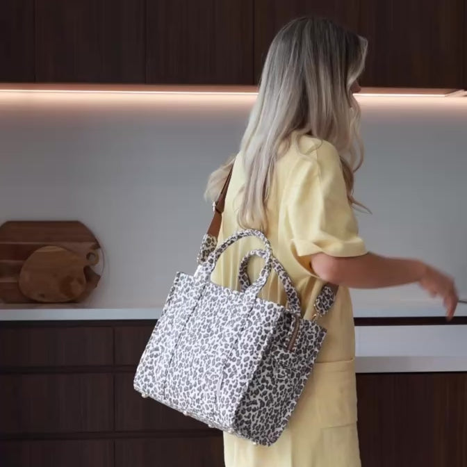 Load video: Small Structured Tote Bag in signature coated canvas -- Tan/Leopard
