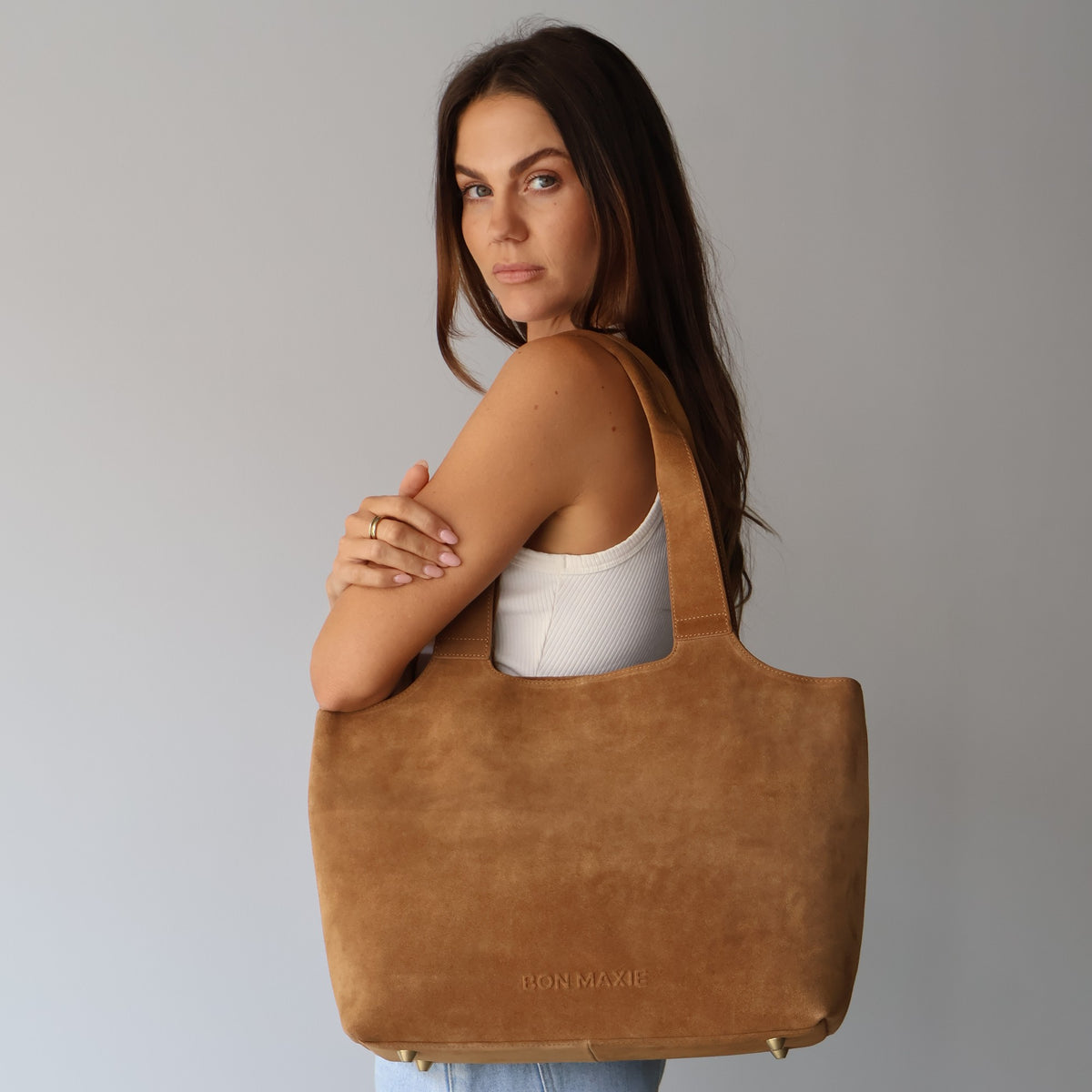 Maven Tote in Tan Suede, worn on the shoulder